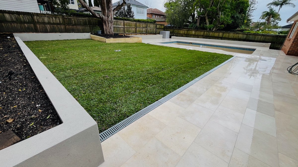 mypoolpainter's tweet photo. Sydney based, Text us @ 0438 553 000  Lawn was removed, new drainage installed, yard levelled,new lawn laid, 46 mtrs of new planter boxes, new &amp; extended paving, frameless glass pool fence.  #landscaping #swimmingpools #paving #backyardmakeover https://t.co/wNKlY3RLhX