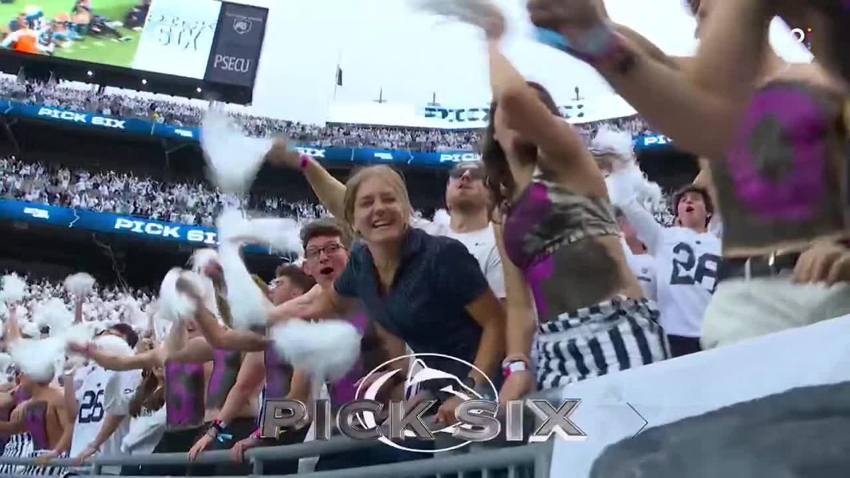 PSECU-branded football fans cheer wildly with white pom-poms, while a "PICK SIX" graphic overlay promotes a Josiah Zayas touchdown highlight from Penn State football.