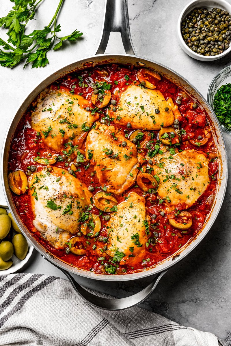 Diethood's tweet photo. Chicken puttanesca made with tender, juicy #chicken thighs cooked in a rich tomato-based sauce with garlic, briny olives, and capers. This easy #Italian dish makes a delicious dinner! #FoodMood #recipes https://t.co/LgFefKkQ7z https://t.co/3GUQz2w32K