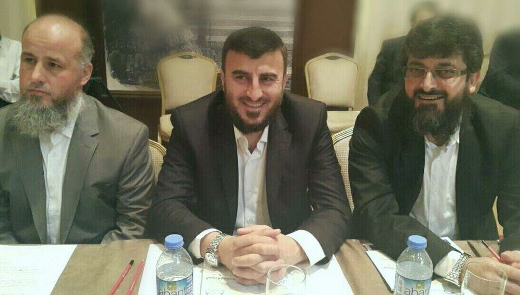 TomLevin7891's tweet photo. For those confused who the man in the video is - it is “Zahran alloush” the leader of ‘jaysh al “Islam”’ a faction in Syria under the “Islamic” front coalition 

A notorious scumbag, intelligence agent and sahwaji 

the dog alloush https://t.co/z7CqjdzLeL