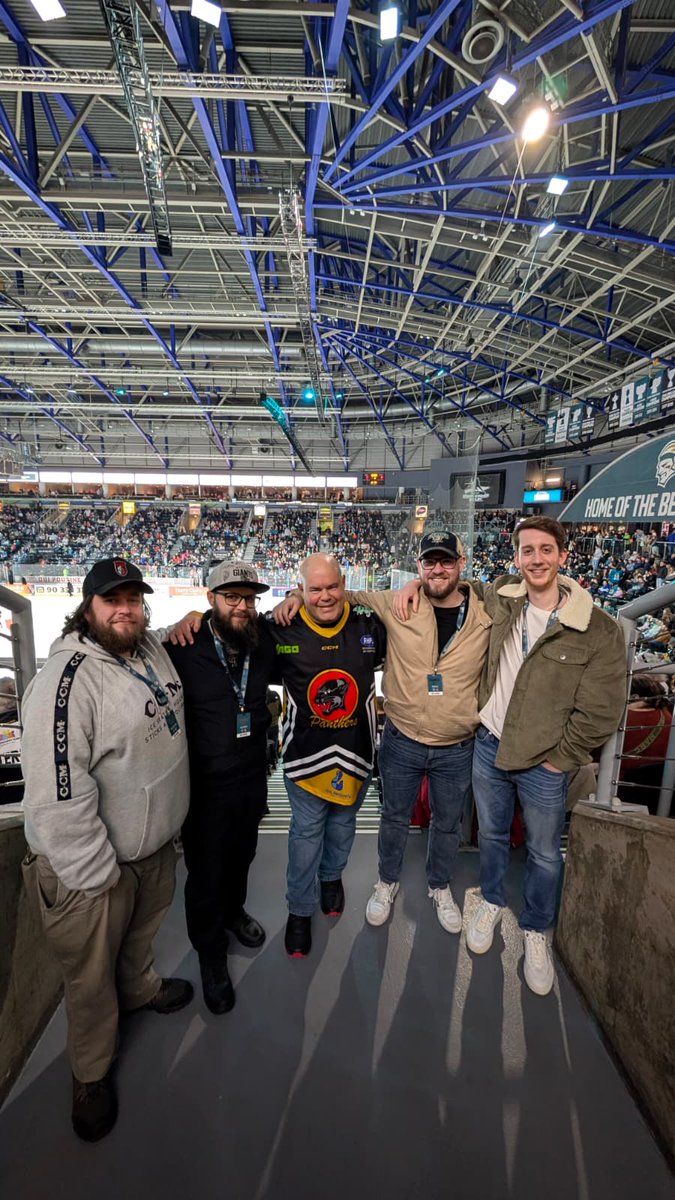 AlanMarchSport's tweet photo. 🏒🎙️ ONE YEAR ON THE ICE!

This weekend marks one year since Alan March Sport launched Audio Description Commentary with the Belfast Giants – and what a year it’s been!
On 27 September 2025, our newly trained team of Audio Description commentators went live for the very first time, beginning a service designed to ensure blind and low vision spectators could experience all the speed, skill, atmosphere and excitement of a Giants game night.
And this one was particularly special for AMS.

The Belfast Giants became the first professional ice hockey team to join our growing family of clubs, taking us into a completely new sport and helping to launch the first service of its kind in the Elite Ice Hockey League. 🏒
Twelve months later, we’re delighted to still be breaking the ice and working alongside the Giants to make live sport more accessible.
Our fantastic commentators have had to learn a whole new sporting language, following the puck, describing the action at incredible speed and making sure our listeners don’t miss those crucial moments.
Safe to say, they’ve absolutely smashed it out of the rink! 😏

Audio Description isn’t simply about telling somebody where the puck is.
It’s about bringing the whole experience to life; the movement, the atmosphere, the physicality, the celebrations and those split-second moments that make live sport so special.
Most importantly, it gives blind and low vision supporters the opportunity to enjoy the game alongside everyone else.

A huge THANK YOU to everyone at the Belfast Giants and to every one of our volunteer commentators who has given their time and enthusiasm to make it work. @Japsimpson  Jordan, Aaron and Jack and to their expert trainers @hope_bradley  and @JonoBullard 
One year down and we’re only just getting warmed up! 🔥🏒

Here’s to another season of goals, saves, big hits…and hopefully keeping ourselves out of the penalty box! 😂
A packed crowd watches the action at a Belfast Giants ice hockey game, with the rink in the foreground and large “Home of the Belfast Giants” branding above the stands
If you're a sports club, venue or event organiser looking to improve accessibility for blind and low vision spectators, we'd love to talk.
From football and ice hockey to major international sporting events, Alan March Sport can provide the training, equipment and expertise to build and deliver your Audio Description service.
🌐 https://t.co/WiPJnXoEMR
📧 info@alanmarchsport.com

Who’s next? 👀🎙️

#AudioDescription #Accessibility #BelfastGiants #IceHockey #SportForAll #Inclusion #BlindAndLowVision #AlanMarchSport #SportsAccessibility