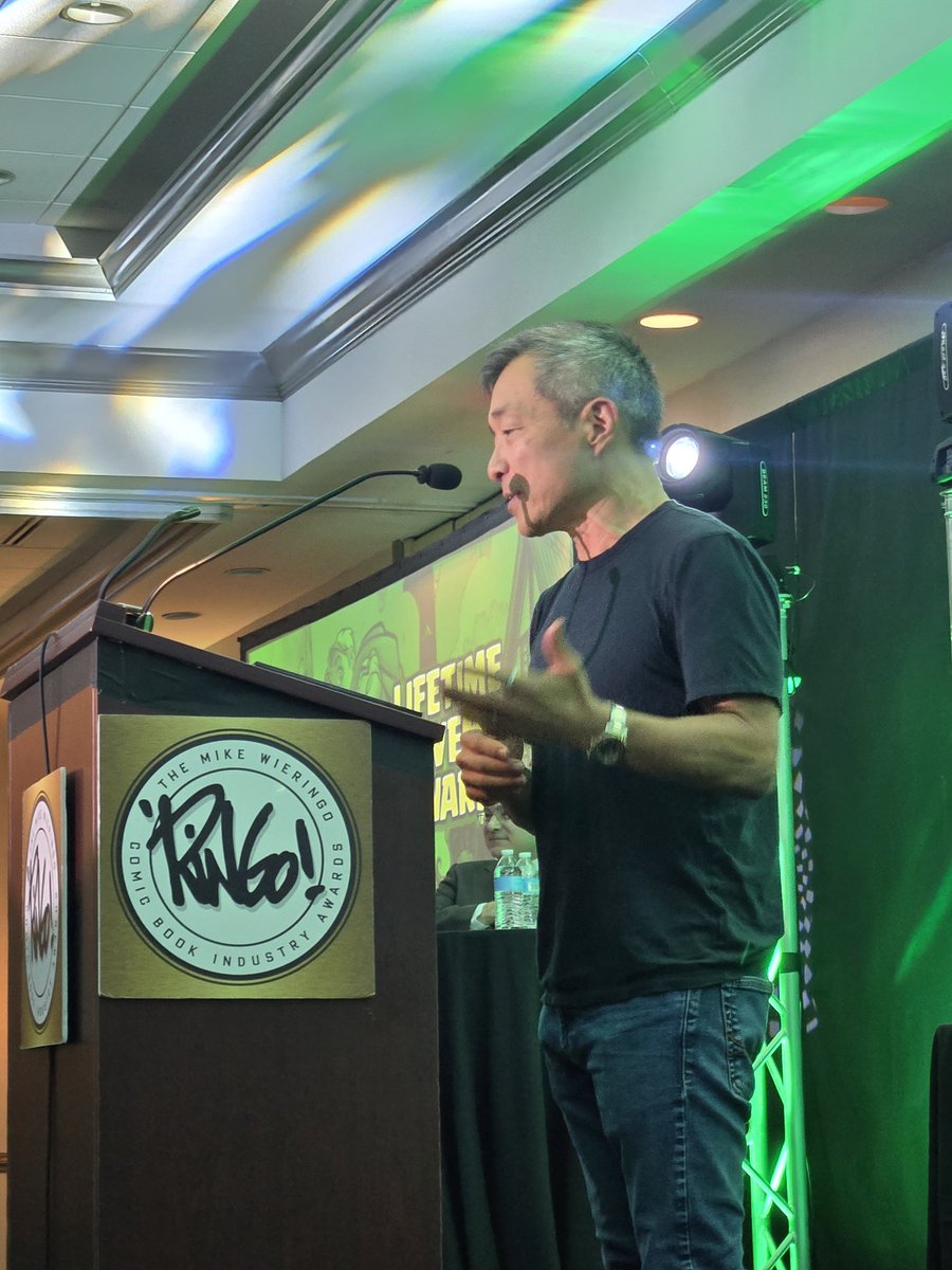 heroinitiative's tweet photo. Congratulations to @JimLee, recipient of the Hero Initiative Lifetime Achievement Award! @sdunbier presented him with the honor tonight at the @ringoawards during @baltimorecomics. Please join us in celebrating Jim! #BeTheHero #BCC2026

#BeTheHero #BCC2026 https://t.co/bik8DIjibI