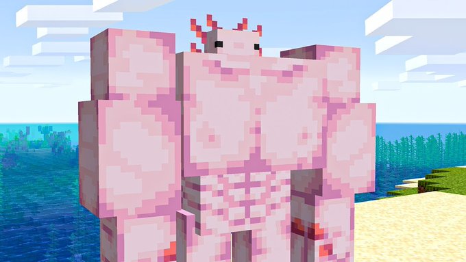 A large pink axolotl character from the Minecraft game stands on a sandy beach near water and grass.
