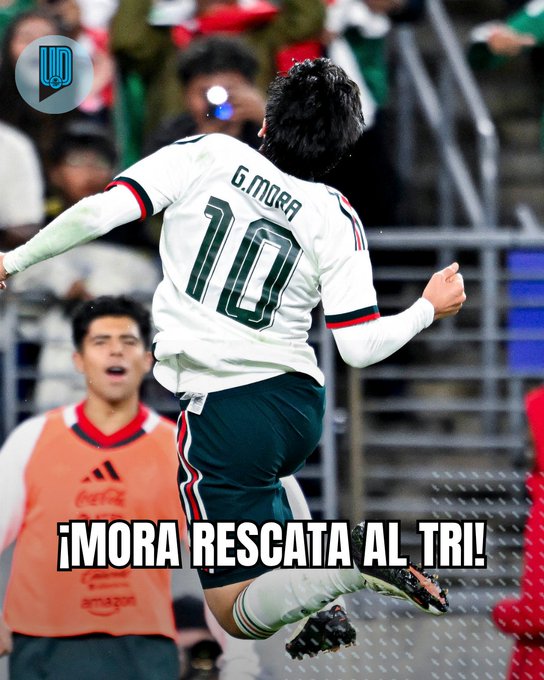 Mexican player G. Mora (#10) leaps in celebration wearing the white Mexico jersey, with the caption "¡MORA RESCATA AL TRI!" displayed across the image, capturing the moment he scored a crucial equalizing goal against Colombia as noted in the post.