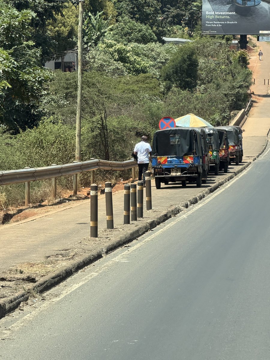 Alfayaz11's tweet photo. Dear @KeNHAKenya, kindly take a drive along the Redhill Bypass and see what is happening.

The pedestrian walkways and paths are slowly being taken over by tuk tuks, while small stalls and vibandas are mushrooming along the entire bypass. Why can’t we have an organised way of accommodating eateries and small businesses, as we see along major highways in many of the countries we constantly say we want to emulate?

Meanwhile, our national failures @ntsa_kenya can happily come and arrest pedestrians while ignoring the lawlessness happening right in front of them.

The damage being done to the infrastructure and kerbs is clearly visible, with tuk tuks and boda bodas illegally crossing the bypass and creating stages along the road.

Incompetence, corruption and lack of enforcement are slowly destroying what was once a beautiful and organised city. At this rate, I will not be surprised to see full markets, boda stages and tuk tuk termini mushrooming along the entire bypass. We watch disorder begin, allow it to become normal, then wonder how we got here.

#ReclaimNairobi