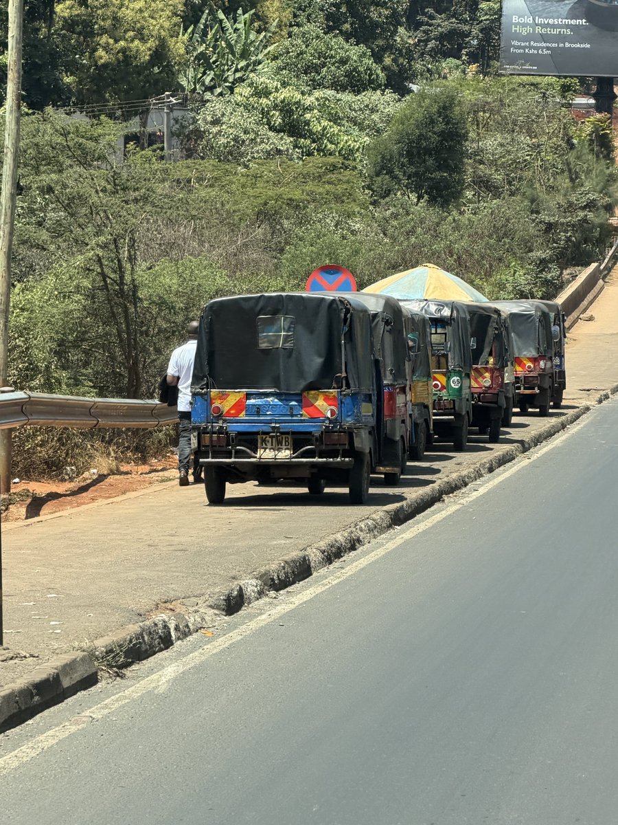 Alfayaz11's tweet photo. Dear @KeNHAKenya, kindly take a drive along the Redhill Bypass and see what is happening.

The pedestrian walkways and paths are slowly being taken over by tuk tuks, while small stalls and vibandas are mushrooming along the entire bypass. Why can’t we have an organised way of accommodating eateries and small businesses, as we see along major highways in many of the countries we constantly say we want to emulate?

Meanwhile, our national failures @ntsa_kenya can happily come and arrest pedestrians while ignoring the lawlessness happening right in front of them.

The damage being done to the infrastructure and kerbs is clearly visible, with tuk tuks and boda bodas illegally crossing the bypass and creating stages along the road.

Incompetence, corruption and lack of enforcement are slowly destroying what was once a beautiful and organised city. At this rate, I will not be surprised to see full markets, boda stages and tuk tuk termini mushrooming along the entire bypass. We watch disorder begin, allow it to become normal, then wonder how we got here.

#ReclaimNairobi