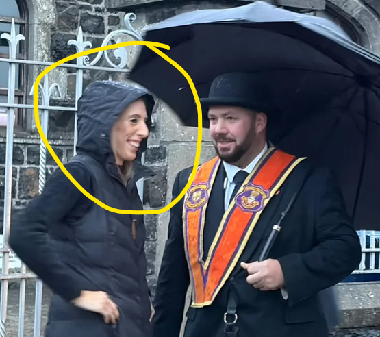 LarsNotViking's tweet photo. Look at the nauseating smirk on the face of this depraved sectarian harpy, from just a few minutes ago. As fear for the innocent residents of the Garvaghy Road returns this wretch smirks as her cheap pantomime terrorism injects her with a false relapse of the old supremacist power feeling.