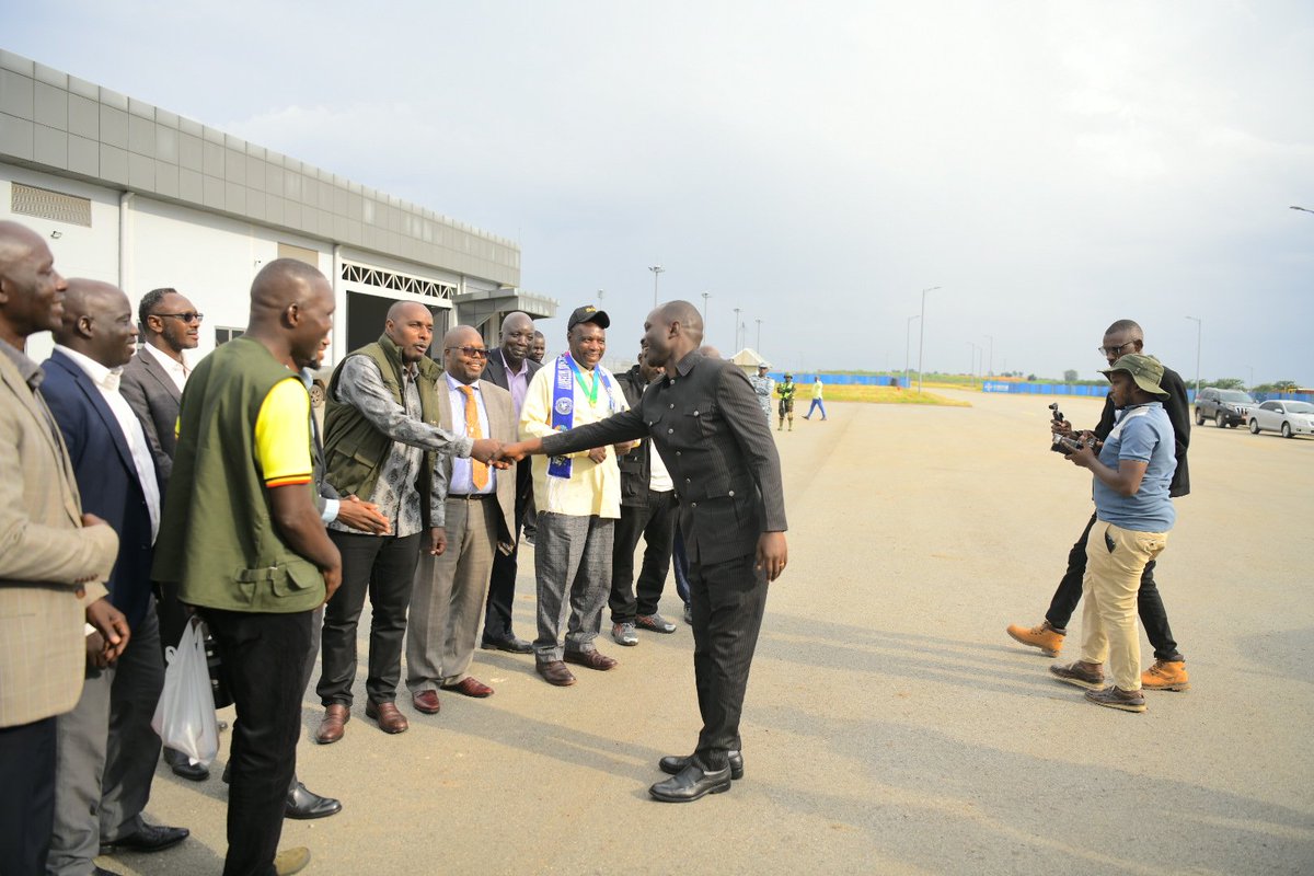 sussiekats's tweet photo. @HonByamukama the Minister of @MoWT_Uganda is at Kabalega International Airport, Hoima, to receive the Uganda Airlines flight chartered by #FUFA, carrying the Uganda Cranes and their delegation ahead of Tuesday's #AFCON2027 qualifier against Libya at Hoima City Stadium.
The flight marks @UG_Airlines maiden landing at Kabalega International Airport, an important milestone for the airport as Uganda prepares to co-host #AFCON2027 with Kenya and Tanzania next year.
Kabalega International Airport and Hoima City Stadium are key pillars of the country's AFCON preparations, supported by ongoing works to upgrade the road network in and around Hoima City to ease movement of teams, fans and visitors during the tournament.
The Ministry of Works and Transport remains committed to delivering the transport infrastructure needed to host a successful #AFCON2027. #PamojaAFCON #UgandaCranes
@UCAA_Spokesman