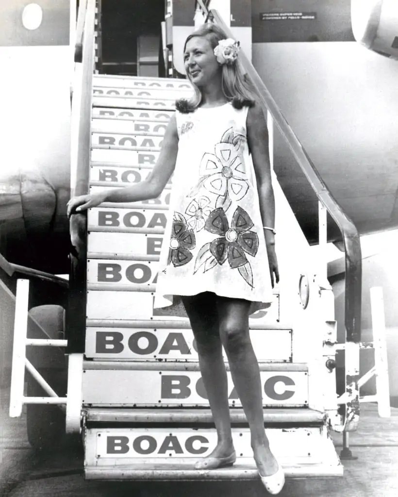 UKBorderWatch's tweet photo. Pat Bleasdale wore BOAC’s throwaway cabin uniform

In 1967, the 27-year-old stewardess modelled a fire-resistant, paper-like dress for New York-Caribbean flights.

Crew cut each hem no higher than three inches above the knee, then binned it after one flight; the fragile experiment lasted under a year.