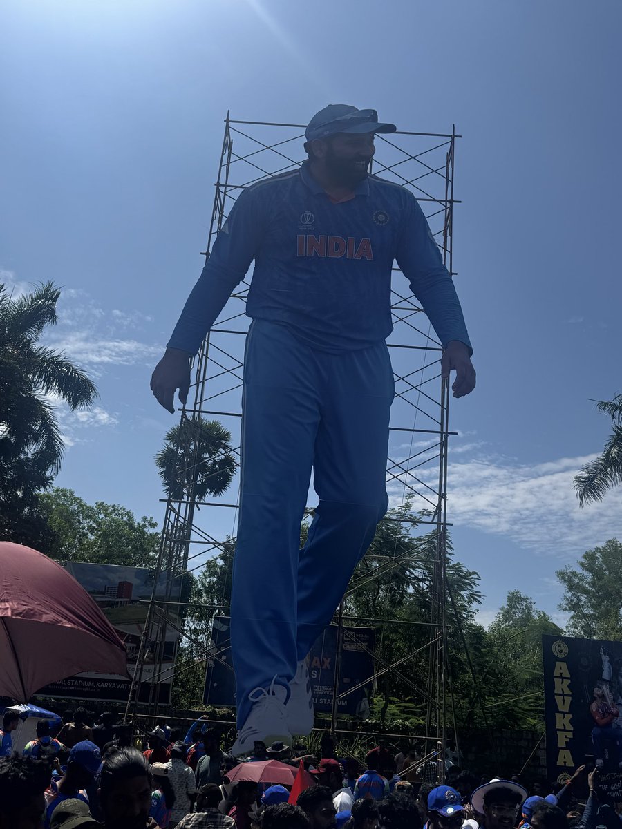rawatrahul9's tweet photo. This 50-foot cut-out of Rohit Sharma outside the stadium in Tiruvananthpuram has become a tourist destination of sorts. The fan clubs of both Rohit and Virat have done their bit to make their presence felt, and you just can’t ignore them here. https://t.co/8SSntnB17k