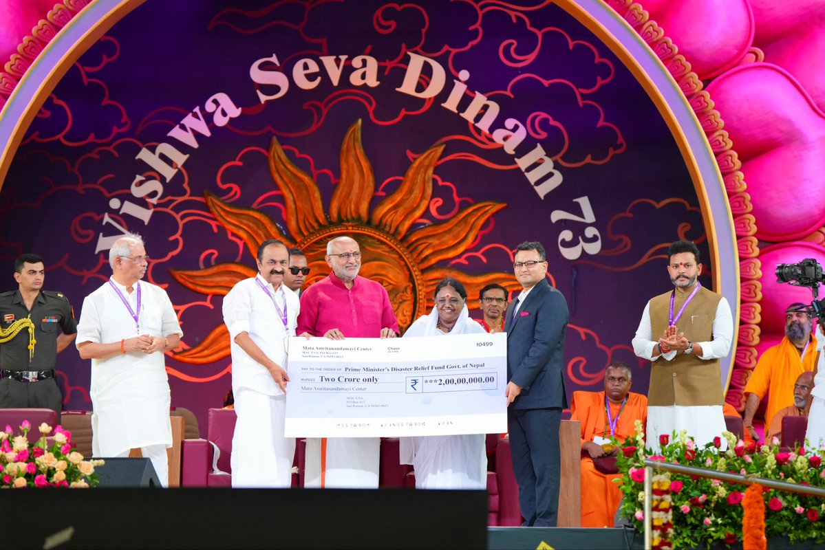 VPIndia's tweet photo. Vice President Shri C. P. Radhakrishnan launched several humanitarian initiatives of Mata Amritanandamayi Math during the Vishwa Seva Dinam celebrations at Amritapuri, Kollam.

The initiatives include ₹2 crore assistance for Nepal flood relief, free surgeries for underprivileged beneficiaries, financial assistance to fishermen’s families, and support for AmritaSREE and Amrita SeRVe initiatives.