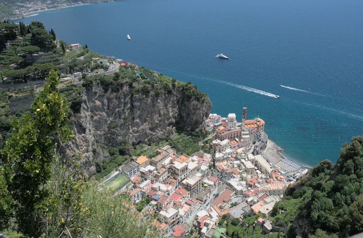 QuickFindGlobal's tweet photo. Two Women, One Rock. A Postcard From Italy
Above the postcard views of Amalfi and Atrani stands a stone tower that the older locals still avoid. Down below, a path worn smooth by women's feet connects the two towns https://t.co/MEEiVD1zE1 https://t.co/0OHHN1E9YG