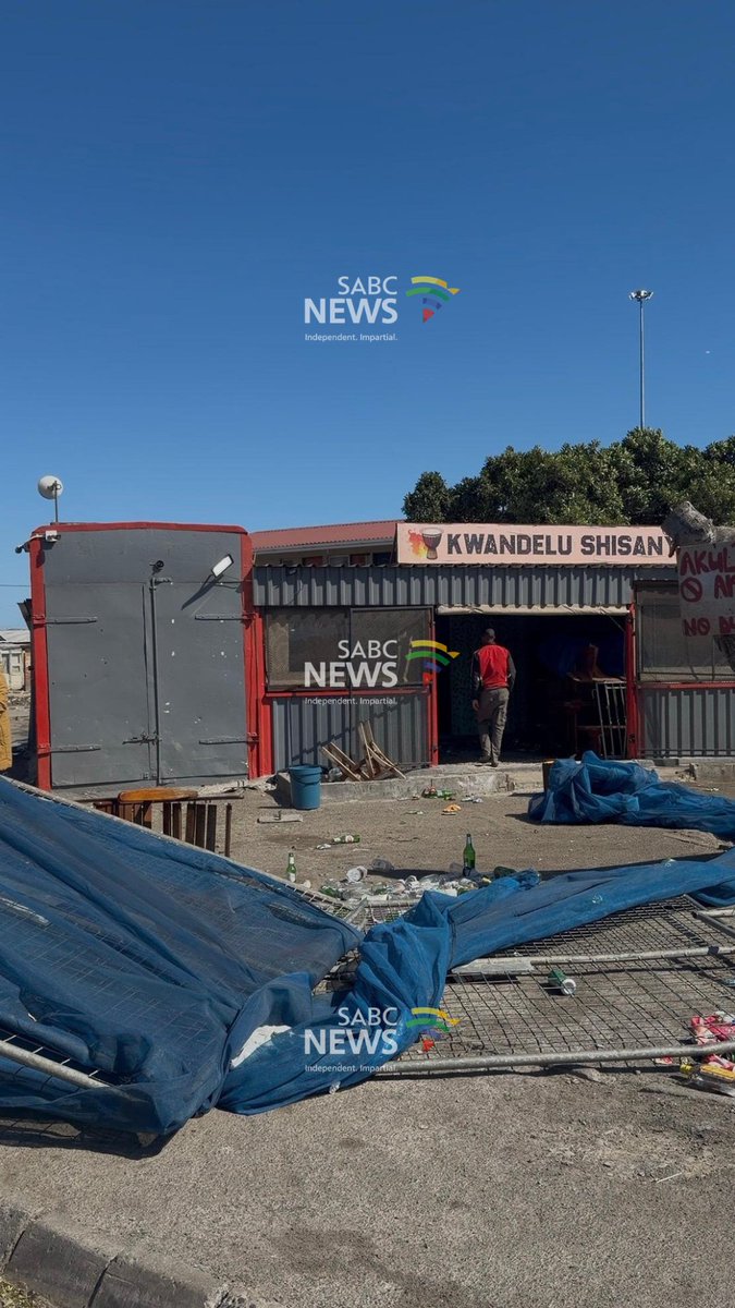 SABCNews's tweet photo. [IN PICTURES] There are scenes of shock and disbelief in the Strand community of Lwandle following this morning's a mass shooting in which ten people were killed at a popular entertainement venue, eleven others were wounded. 
📸: Vanessa Poonah https://t.co/FTkWfp2qh1