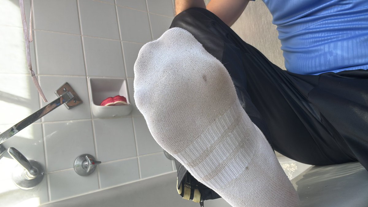 DOM_Master_GER's tweet photo. You wake up.
The first thing you see today is my sweaty sole pressed right in your face, stuffed into a tight white sock that’s already damp and clinging to every wrinkle of my foot.
The fabric is thin enough that you can see the shape of my toes and the wet patch under the ball of my foot. It smells like I wore these all night and then put them back on this morning just for you.
Stay down there. That’s the view you’re starting the day with.