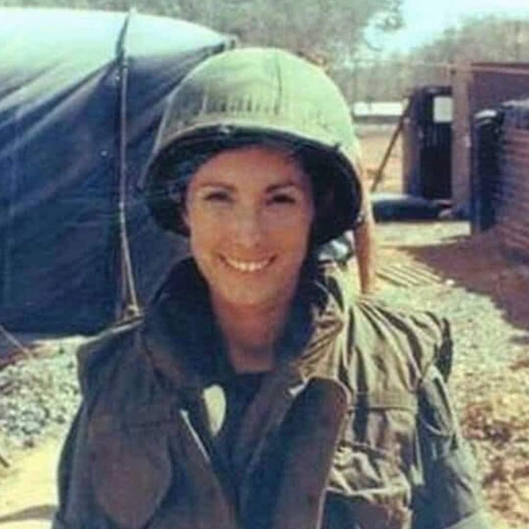 SoldiersWhisper's tweet photo. Kate O’Hare-Palmer served as a US Army nurse, evacuation hospital in Vietnam, 1968.

“We were overrun once as a hospital unit,” she said. “We were hiding patients, and putting them into containers; hoping to keep them safe. We stayed inside the fence.” Tending to the wounded and the dying became etched in her mind, haunting her for decades after the war. She looked for ways to stay grounded while in-country, and the things that helped her cope there helped her cope back home, too.

“I started trading my (medical) instruments for chickens so that I could get fresh eggs,” she said. “Some (other military personnel) had dogs. Pets were helpful. I had 10 chickens before I left. The engineers built me a little chicken coop. The dogs got after one of them, and I took it into the ER and got an IV into it to save it.”

“Flying home to Travis Air Force Base, we were bussed to the Oakland depot with protestors throwing rotten vegetables at us. It was shocking … we were not prepared for this. How could this be? We had left one war zone to arrive in another,” she stated. 

She returned from the war to work at VA hospitals, including Fort Miley in San Francisco, but her experiences as a surgical nurse never left her.

“I had trouble even seeing blood,” she said. She had nightmares about it, which convinced her to move out of surgical nursing. She used her GI Bill education benefits to get her degree. She spent more than 30 years in nursing; became an advocate for women veterans, speaking out about everything including post-traumatic stress disorder. God bless Kate and all our Angels in Fatigues! 

#TheVietnamWar