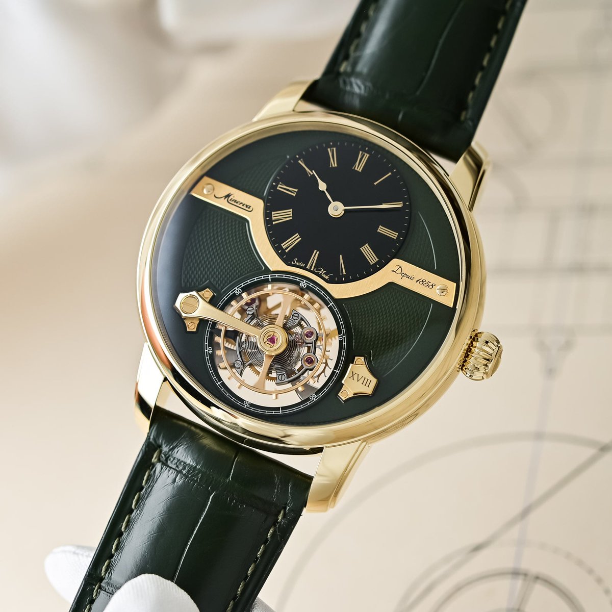 BEYODTHEDIAL's tweet photo. Minerva putting the balance *above* the tourbillon cage is either brilliant or slightly unhinged. Possibly both.

“Exo” = outside: the oscillator sits on top of the rotating cage instead of hiding in it. Olive guilloché, black onyx hours, yellow gold — 18 pieces. Also: 44.8 × 15.03 mm and 30 m. Architecture you can see, thickness you will feel.

(Press / first-look images via Monochrome — not ours.)