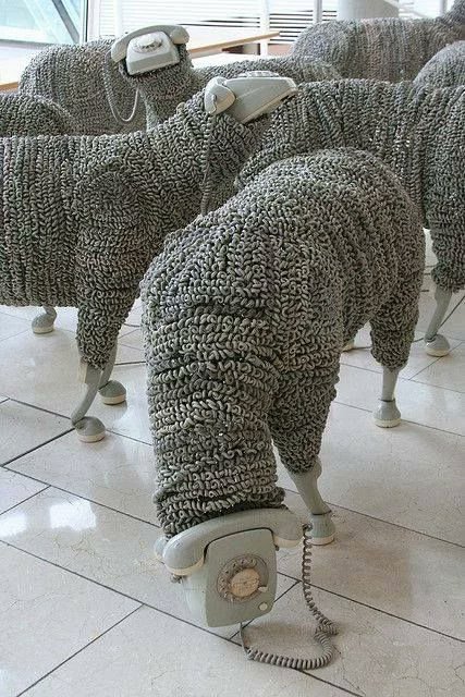 TacitusChrono's tweet photo. I can’t decide what’s more unexpected — a flock of sheep made from old telephones, or how perfectly it actually works. https://t.co/aFwm59Ms9h