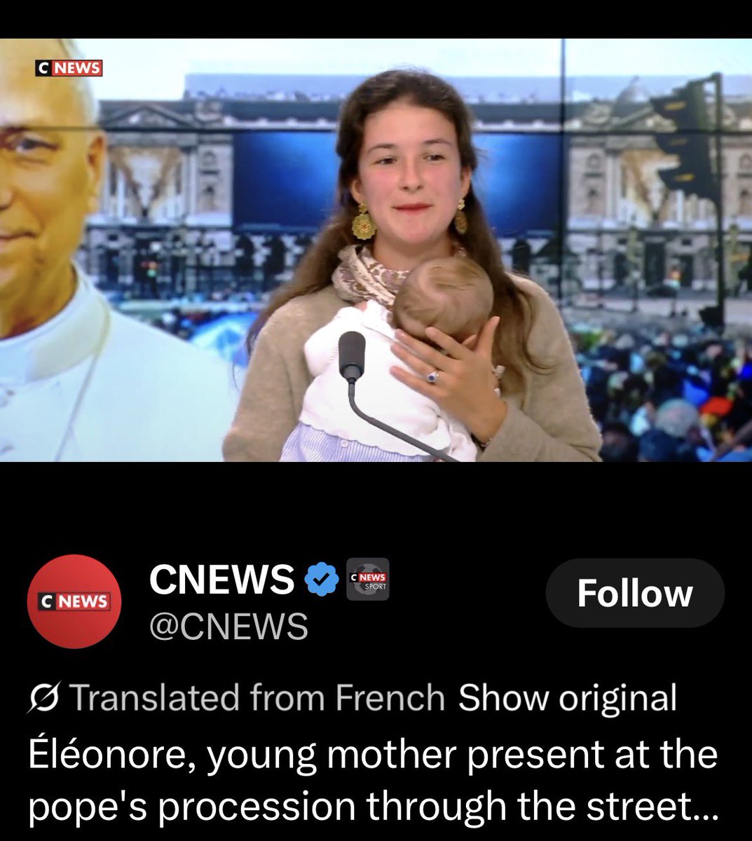 appyobliged's tweet photo. A French mother went on CNews to speak about the Pope’s visit but I want to breakdown the effortless style of the Parisian. 

-Natural hair, healthy, thick. Simple style. 

-Minimal makeup. She looks like she isn’t wearing any except lipstick. 

-Natural nails. Groomed, clipped close. Either no polish or a minimal polish. 

-Simple beige sweater, most likely cashmere (natural fibers), silk scarf for some gentle contrast and color. 

-Gold earrings. Large but not flashy. 

-Simple wedding band, not huge.
