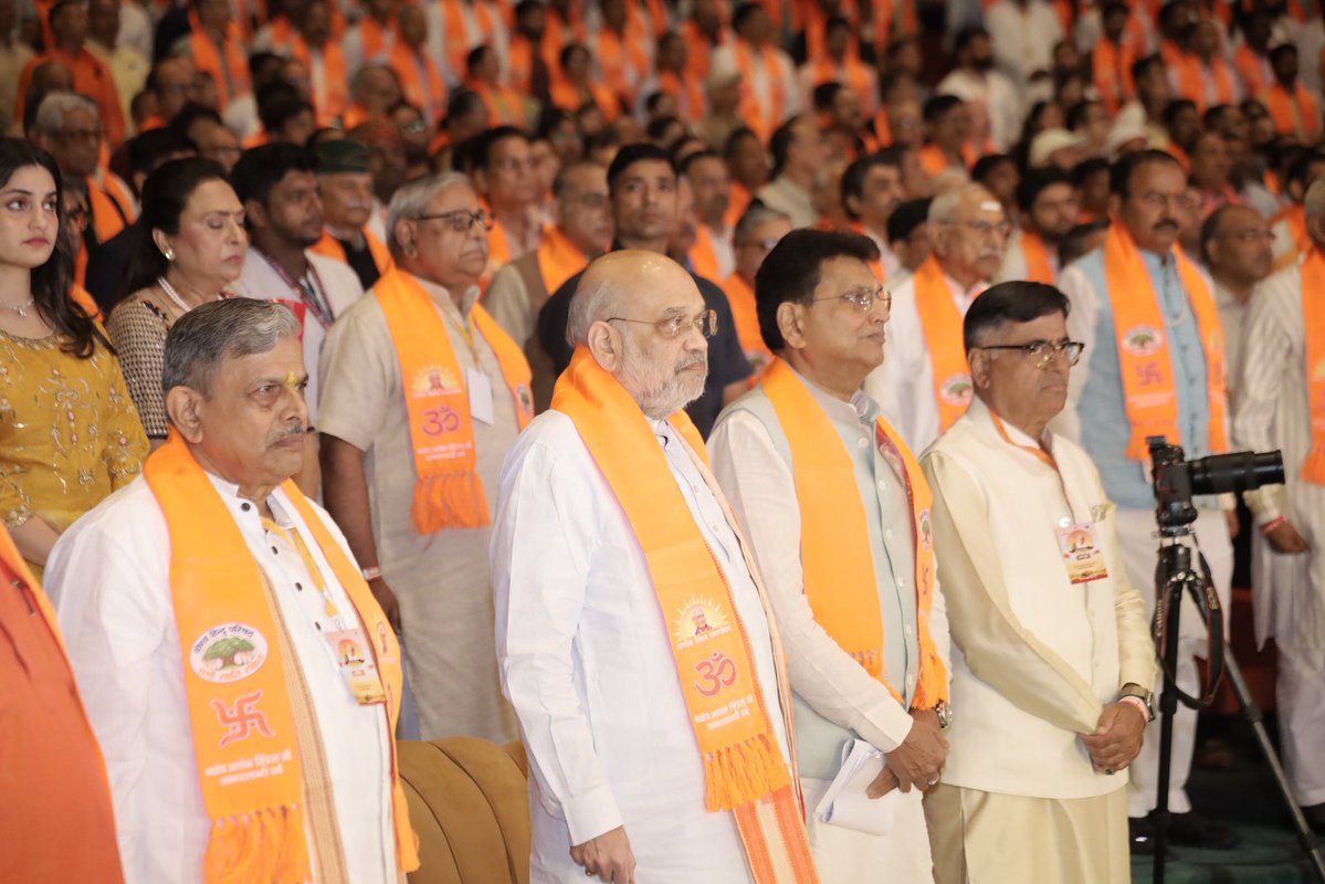 VHPDigital's tweet photo. Union Home Minister Shri Amit Shah Inaugurates the Birth Centenary Year of Revered Shri Ashok Singhal at Bharat Mandapam

The youth should take inspiration from the life of Shri Ashok Singhal Ji: Shri @AmitShah, Union Home Minister 

New Delhi, 27 September 2026: The Birth Centenary Year of revered Shri Ashok Singhal ji was inaugurated today at a grand ceremony held at Bharat Mandapam, New Delhi, organised by the Vishwa Hindu Parishad (VHP) and the Ashok Singhal Foundation. Union Home Minister Shri Amit Shah, as Chief Guest, led the nation in paying tribute to the visionary leader whose life was devoted to Bharatiya culture, spiritual awakening, the organisation of Hindu society, and the Shri Ram Janmabhoomi movement. The ceremony honoured his inspiring life, far-sighted thought, and unparalleled contribution to the nation and society.

Addressing the houseful of Ram bhakts, Amit Shah, Union Home Minister, said, _"Shri Ashok Singhal ji dedicated his life to the nation, society and the preservation of India's cultural heritage. His contribution to the Ram Janmabhoomi movement and his lifelong commitment to the cause of cultural resurgence will continue to be remembered. "The Vishva Hindu Parishad & Ashok Singhal Foundation is doing commendable work by commemorating his birth centenary and bringing his life, values and contributions to a wider audience, particularly the youth. These celebrations are an important opportunity for the younger generation to understand the ideals that guided Shri Ashok Singhal ji and draw inspiration from a life devoted to the nation and society. I am confident that this initiative will help carry his legacy and message to generations to come."
Param Pujya Yugpurush Mahamandaleshwar Swami Paramanand Giri ji Maharaj said, _"This is our country, and it is our responsibility to protect all that belongs to it. We must remain vigilant towards our society and our Dharma, continue to work hard, and contribute towards making our nation stronger and more progressive, as was the ideology of Shri Ashok Singhal Ji."_

The ceremony opened with a conch invocation (shankhnaad) and the chanting of Vedic mantras by 100 ritwiks, reflecting Shri Singhal ji's deep faith in the Vedic tradition, Indian knowledge systems and spiritual consciousness.

A central highlight of the evening was the release of the coffee table book "Maryada Purushottam Shri Ram Ke Divya Padchinh" (The Divine Footprints of Lord Ram), a publication that presents the life-values, ideals and enduring cultural influence of Lord Ram on Indian society. On the occasion, a replica of the 'Shri Ram Stambh' was also unveiled and put on display.

On this auspicious occasion, *Dattatreya Hosabale, Sarkaryavah, Rashtriya Swayamsevak Sangh,* said, _"Shri Ashok Singhal ji possessed a rare combination of firmness in conviction and sensitivity towards the suffering of others. Once he took a decision, he remained steadfast and would focus not on whether a task was difficult, but on finding the path to accomplish it. His contribution extended across several spheres, from the work of the Sangh and the Vishwa Hindu Parishad to initiatives concerning India's cultural heritage, social service and the preservation of our traditions. He was not merely a person who held strong convictions; he had the ability to translate those convictions into organised and sustained action."

The gathering witnessed the digital launch (lokarpan) of the Shri Ram Stambhs to be installed along the Ram Van-gaman Path in Ayodhya district, an effort to connect the public with the memory of Lord Ram's journey and the cultural and spiritual sites associated with it. A special exhibition on Shri Singhal ji's life, spiritual values, organizational work, and role in the Ram Janmabhoomi movement was also presented through photographs, documents, and related material.