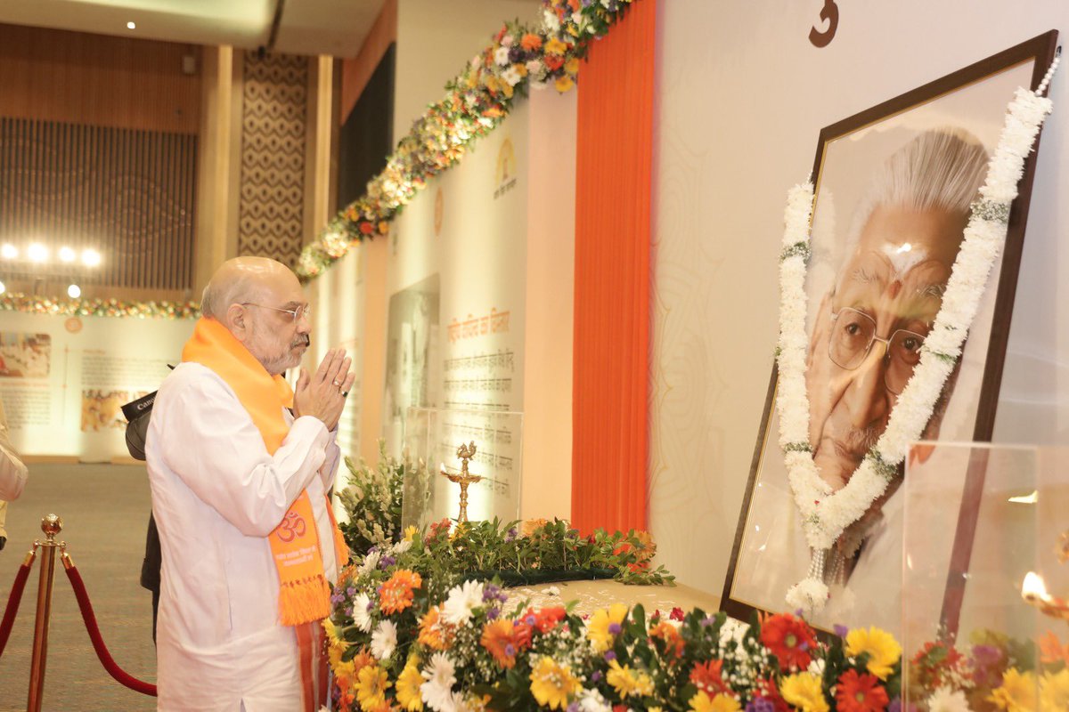 VHPDigital's tweet photo. Union Home Minister Shri Amit Shah Inaugurates the Birth Centenary Year of Revered Shri Ashok Singhal at Bharat Mandapam

The youth should take inspiration from the life of Shri Ashok Singhal Ji: Shri @AmitShah, Union Home Minister 

New Delhi, 27 September 2026: The Birth Centenary Year of revered Shri Ashok Singhal ji was inaugurated today at a grand ceremony held at Bharat Mandapam, New Delhi, organised by the Vishwa Hindu Parishad (VHP) and the Ashok Singhal Foundation. Union Home Minister Shri Amit Shah, as Chief Guest, led the nation in paying tribute to the visionary leader whose life was devoted to Bharatiya culture, spiritual awakening, the organisation of Hindu society, and the Shri Ram Janmabhoomi movement. The ceremony honoured his inspiring life, far-sighted thought, and unparalleled contribution to the nation and society.

Addressing the houseful of Ram bhakts, Amit Shah, Union Home Minister, said, _"Shri Ashok Singhal ji dedicated his life to the nation, society and the preservation of India's cultural heritage. His contribution to the Ram Janmabhoomi movement and his lifelong commitment to the cause of cultural resurgence will continue to be remembered. "The Vishva Hindu Parishad & Ashok Singhal Foundation is doing commendable work by commemorating his birth centenary and bringing his life, values and contributions to a wider audience, particularly the youth. These celebrations are an important opportunity for the younger generation to understand the ideals that guided Shri Ashok Singhal ji and draw inspiration from a life devoted to the nation and society. I am confident that this initiative will help carry his legacy and message to generations to come."
Param Pujya Yugpurush Mahamandaleshwar Swami Paramanand Giri ji Maharaj said, _"This is our country, and it is our responsibility to protect all that belongs to it. We must remain vigilant towards our society and our Dharma, continue to work hard, and contribute towards making our nation stronger and more progressive, as was the ideology of Shri Ashok Singhal Ji."_

The ceremony opened with a conch invocation (shankhnaad) and the chanting of Vedic mantras by 100 ritwiks, reflecting Shri Singhal ji's deep faith in the Vedic tradition, Indian knowledge systems and spiritual consciousness.

A central highlight of the evening was the release of the coffee table book "Maryada Purushottam Shri Ram Ke Divya Padchinh" (The Divine Footprints of Lord Ram), a publication that presents the life-values, ideals and enduring cultural influence of Lord Ram on Indian society. On the occasion, a replica of the 'Shri Ram Stambh' was also unveiled and put on display.

On this auspicious occasion, *Dattatreya Hosabale, Sarkaryavah, Rashtriya Swayamsevak Sangh,* said, _"Shri Ashok Singhal ji possessed a rare combination of firmness in conviction and sensitivity towards the suffering of others. Once he took a decision, he remained steadfast and would focus not on whether a task was difficult, but on finding the path to accomplish it. His contribution extended across several spheres, from the work of the Sangh and the Vishwa Hindu Parishad to initiatives concerning India's cultural heritage, social service and the preservation of our traditions. He was not merely a person who held strong convictions; he had the ability to translate those convictions into organised and sustained action."

The gathering witnessed the digital launch (lokarpan) of the Shri Ram Stambhs to be installed along the Ram Van-gaman Path in Ayodhya district, an effort to connect the public with the memory of Lord Ram's journey and the cultural and spiritual sites associated with it. A special exhibition on Shri Singhal ji's life, spiritual values, organizational work, and role in the Ram Janmabhoomi movement was also presented through photographs, documents, and related material.
