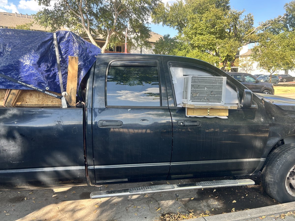 demkidsofmine's tweet photo. I’ve never seen a A/C unit in the window of a vehicle I have so many thoughts, Is this considered unhoused or being innovative? https://t.co/oqAEmcxRy9