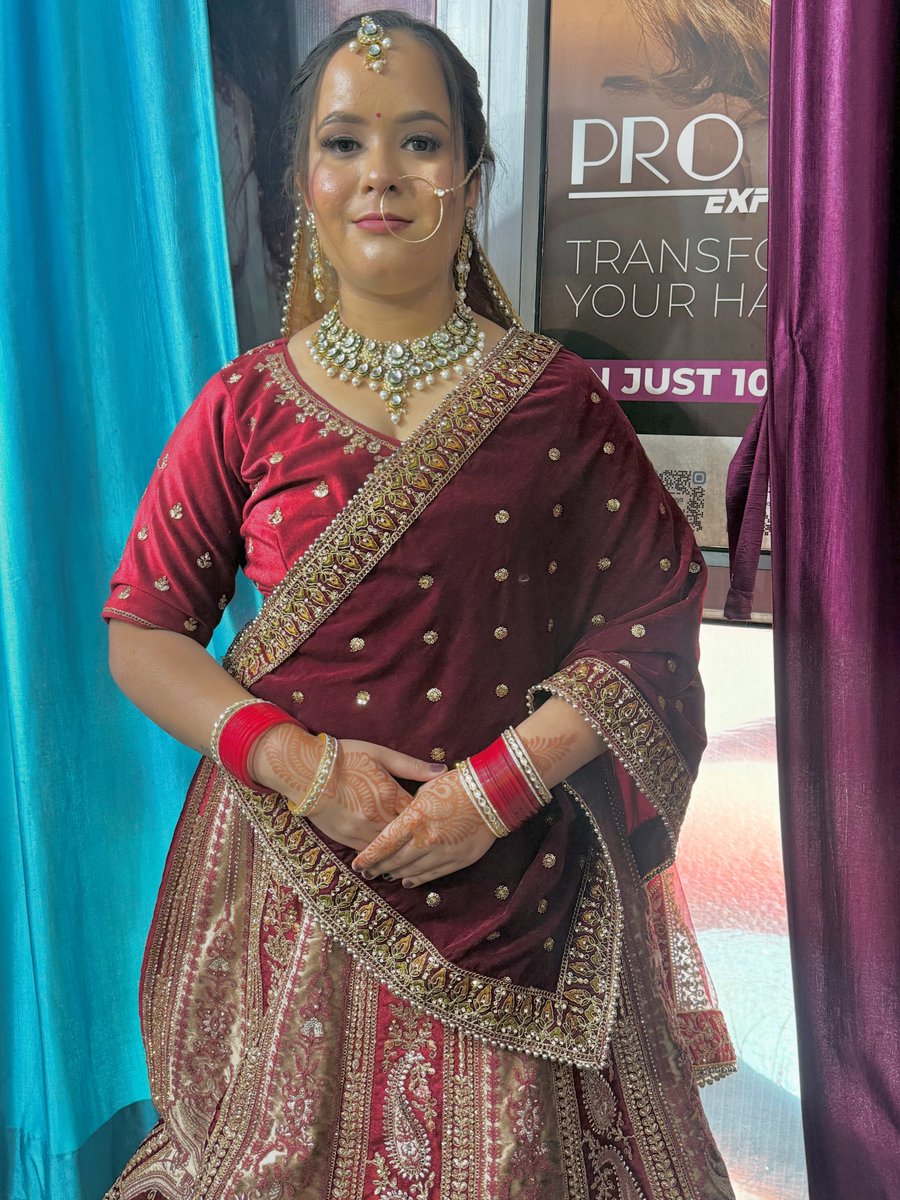 JongStam0k's tweet photo. Confident, graceful, and regal. The modern bride in her royal era, wrapped in red and glowing like a dream. Makeup: @makeupby__ruchi_ 
Outfit: @mishika. _creations https://t.co/JolUKqQWHP
