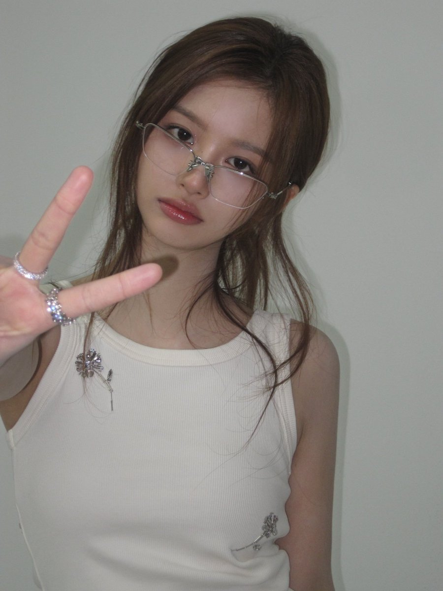 nmixxpics_'s tweet photo. NMIXX’s Sullyoon honest take on sleeping:

“I think sleeping is a waste time. Unless I have a schedule, I have never gone to sleep before 12 AM. I just hate going to sleep early like that. Why would I? I want to do something, anything, during that time. Sleeping time feels like a waste. I wake up early anyway because of my schedules, so I just don't want to waste my night time.

I have this mindset... even though sleeping in a bed is obviously different from sleeping in a car, I can still get some sleep in the car anyway. When we're moving, thankfully our managers drive us, so if the travel time is long, like an hour, I can just sleep then. So why would I force myself to sleep at night? I want to do things that I can only do when I'm at the dorm or hanging out.

I think it's because I can sleep well anywhere. If I was the type who couldn't sleep well in the car, I definitely would have valued my nighttime sleep a lot more. And at the salon too! If I'm the first one to get my hair and makeup done, I honestly have about an hour left at the salon, so I can just sleep then too.”