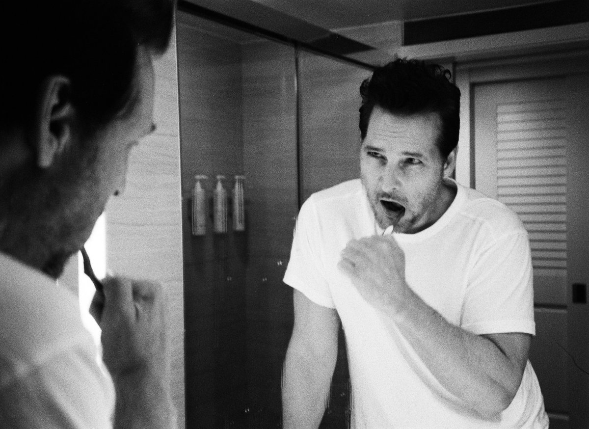 JoshuaShultz's tweet photo. For today’s Fine Art photos I present to you @peterfacinelli brushing his teeth 🦷 shot on Black and White film 🎞️ on @leica_camera #Minilux  on @kodak in Tampa #kodak #leica #twilight https://t.co/eHJ1j8ZqHf