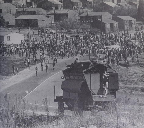HistorySAZAR's tweet photo. Police standby as pupils try to begin a march into Johannesburg, July 1976. Photo Credit: Soweto - The fruit of fear/Peter Magubane https://t.co/G9pzu32q3l