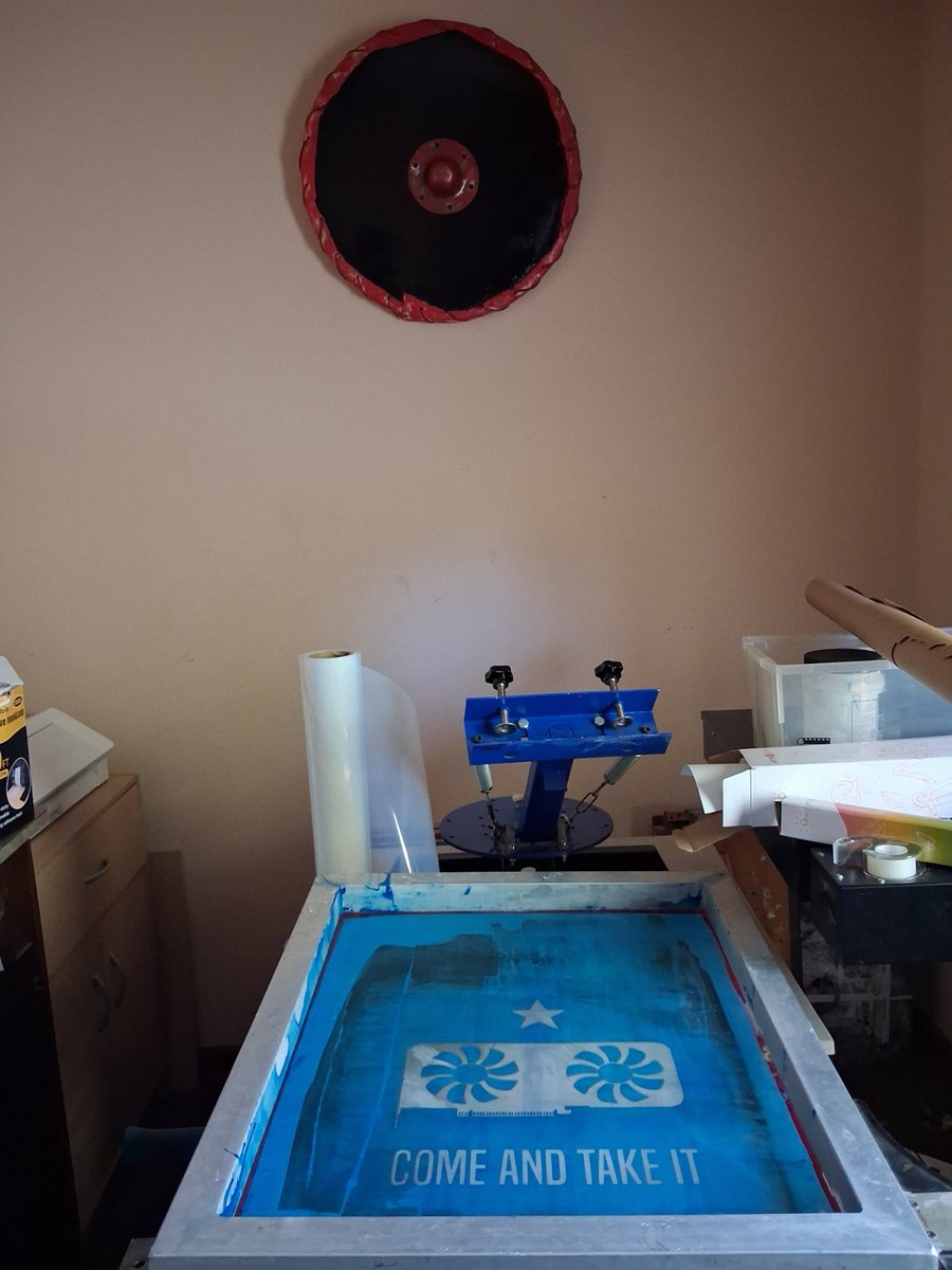 VolkNewsDotC0m's tweet photo. This Viking shield has hung on my print shop wall for years looking hideous. Finally got around to painting it. Wood, steel, leather, canvas, and a rim of soaked pet-store dog bones bent around the edge. Might add to the design later — for now it's done. https://t.co/BHNFDUhYPd