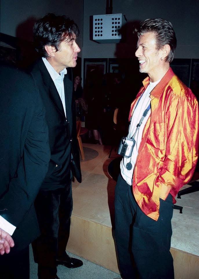 kennylanglea's tweet photo. David Bowie and Bryan Ferry deep in conversation at the London Design Museum, 14th September 1998. Photographs by Alan Davidson #DavidBowie #BryanFerry 📸 https://t.co/aotRIZTLLd