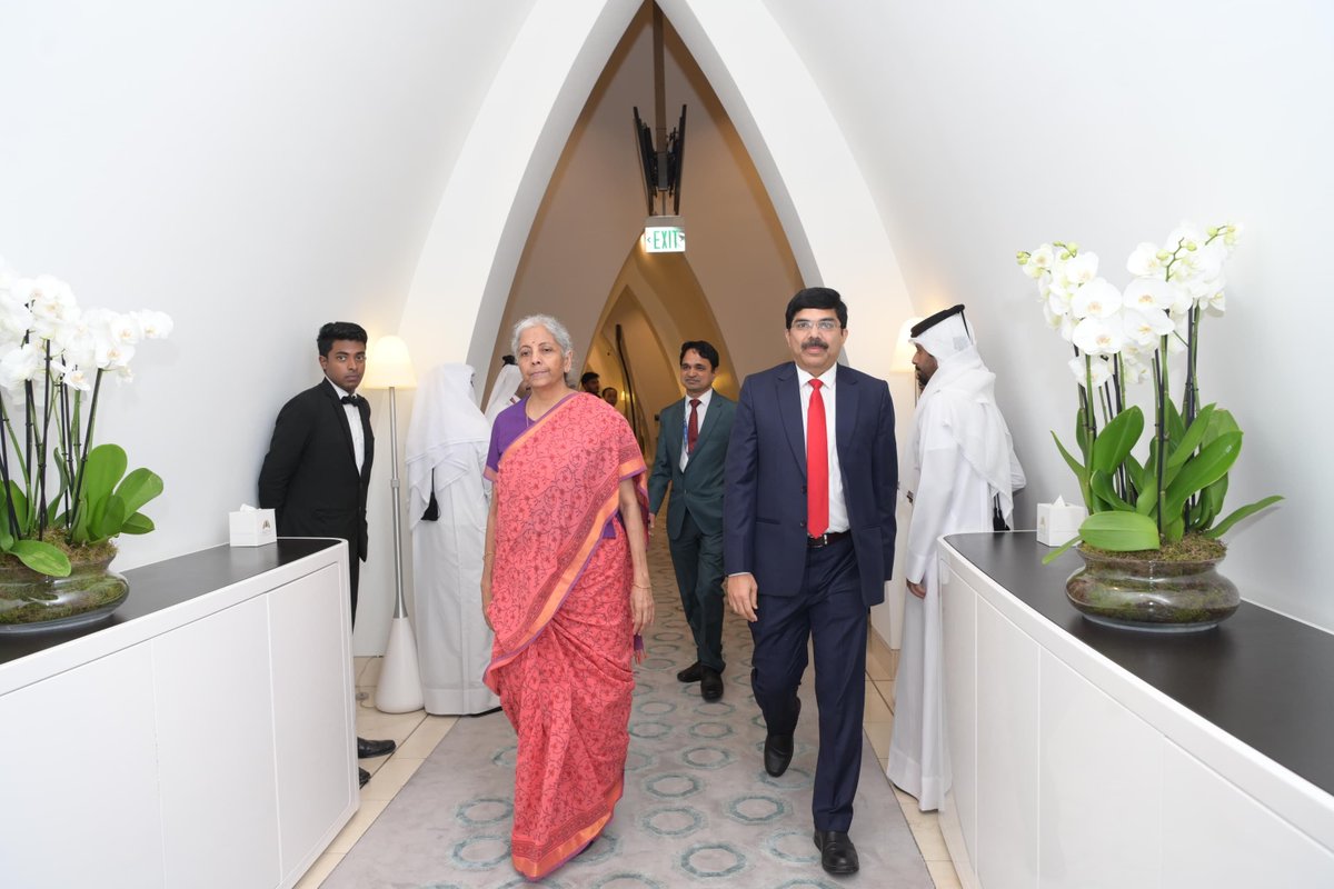 IndEmbDoha's tweet photo. Hon’ble Union Minister for Finance & Corporate Affairs, Smt. Nirmala Sitharaman, was welcomed and received by the Ambassador of India to Qatar, @srikar_koppula, upon her arrival at Hamad International Airport in Doha today. 

The Hon’ble Union Minister for Finance & Corporate Affairs is scheduled to participate in the 11th Annual Meeting of the Asian Infrastructure Investment Bank (AIIB) and the AIIB Investors Dialogue 2026 in Doha over the next two days.

#AIIB2026 #IndiaAtAIIB 

@nsitharaman @nsitharamanoffc
@FinMinIndia @MEAIndia @DrSJaishankar
@IndianDiplomacy @diaspora_india
@PIB_India @DDNewslive @mygovindia