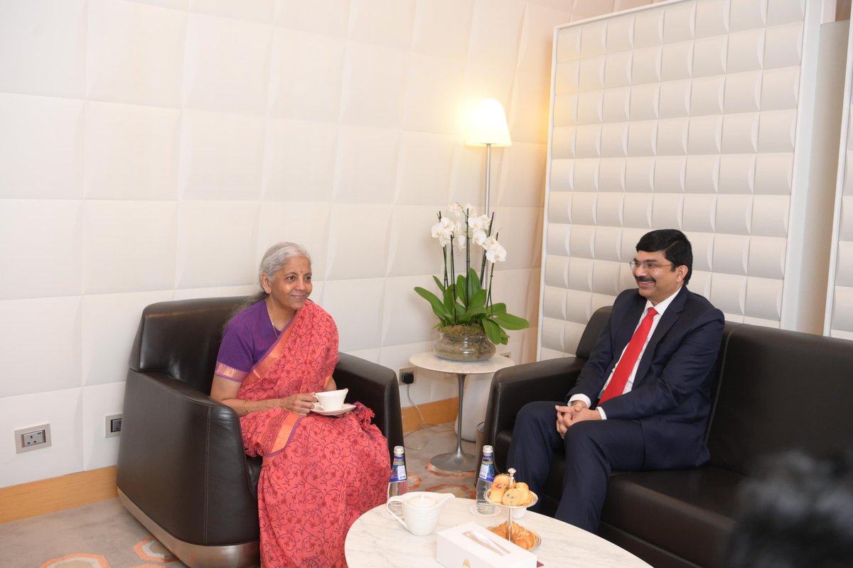 IndEmbDoha's tweet photo. Hon’ble Union Minister for Finance & Corporate Affairs, Smt. Nirmala Sitharaman, was welcomed and received by the Ambassador of India to Qatar, @srikar_koppula, upon her arrival at Hamad International Airport in Doha today. 

The Hon’ble Union Minister for Finance & Corporate Affairs is scheduled to participate in the 11th Annual Meeting of the Asian Infrastructure Investment Bank (AIIB) and the AIIB Investors Dialogue 2026 in Doha over the next two days.

#AIIB2026 #IndiaAtAIIB 

@nsitharaman @nsitharamanoffc
@FinMinIndia @MEAIndia @DrSJaishankar
@IndianDiplomacy @diaspora_india
@PIB_India @DDNewslive @mygovindia