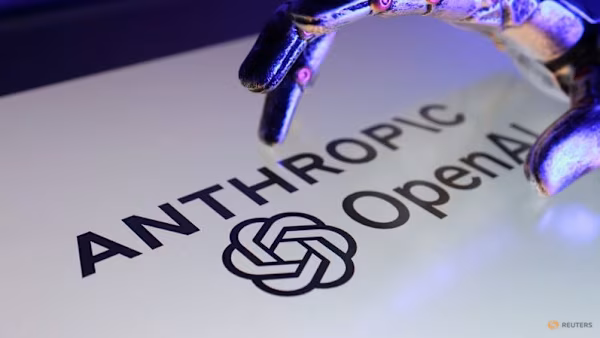 Robotic hand above the Anthropic and OpenAI logos in a Reuters illustration.