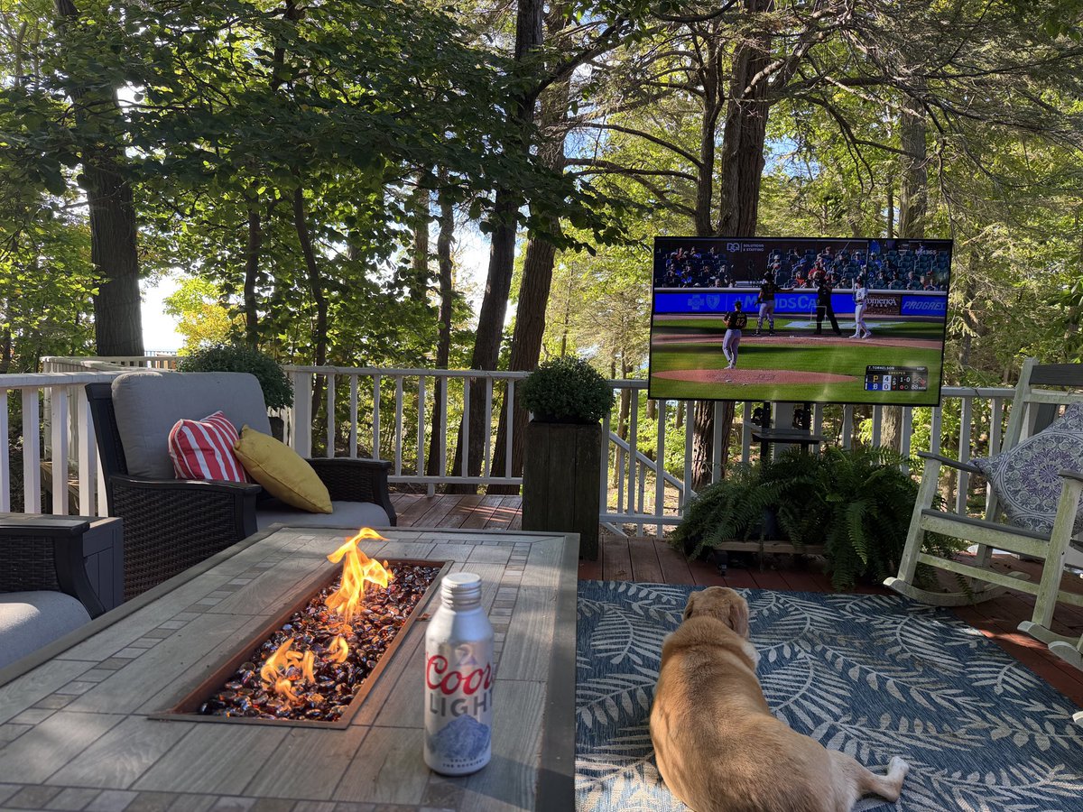JohnKeatingTV's tweet photo. After the Lions win- Annie and I, watching baseball on the last day of the season…glorious Sunday on the deck.  Lake Michigan just beyond.  #grandhavendeck https://t.co/vCvd8exQMf