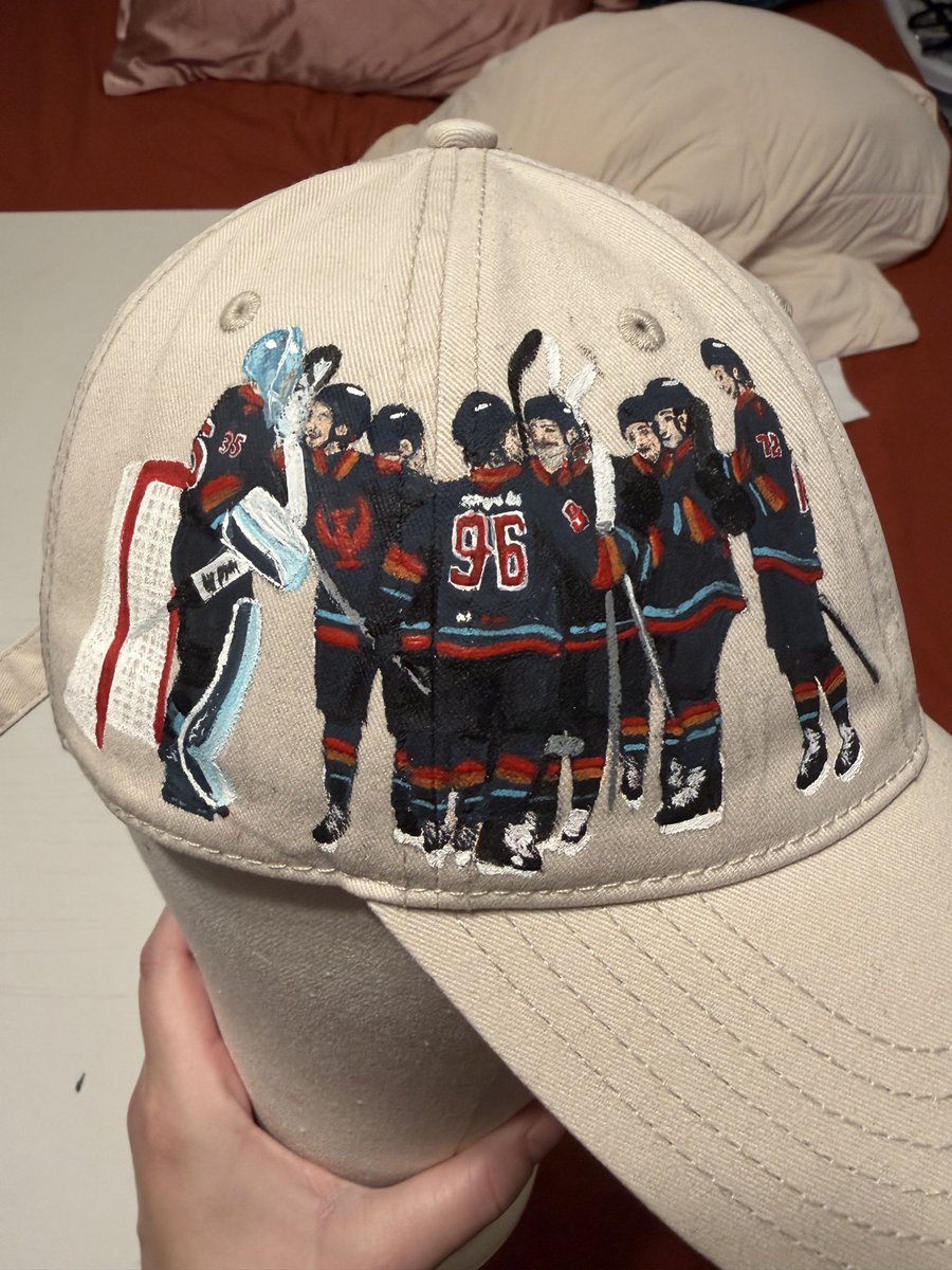snapelle's tweet photo. trying to paint a hat for meet the players tomorrow and idk why I thought this would be easier. I’ll still get the boys to sign the bill but I’m definitely going to give this another go and hopefully I can get my lines cleaner https://t.co/xbqES29nmp