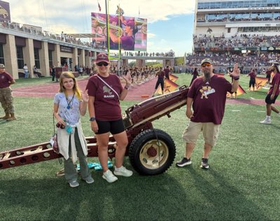 amandac2001's tweet photo. #NewProfilePic My amazing family with @txstbmb color guard in the background. So much of what makes me a proud @txstatealumni in one picture. https://t.co/8TL3QejKIs
