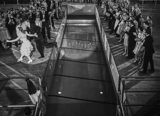 JFMcGowanIII's tweet photo. @johnnymaga How about like the gymnasium floor in It’s A Wonderful Life?  Open it up, slowly, mid-briefing? https://t.co/Q2znQiEEBH