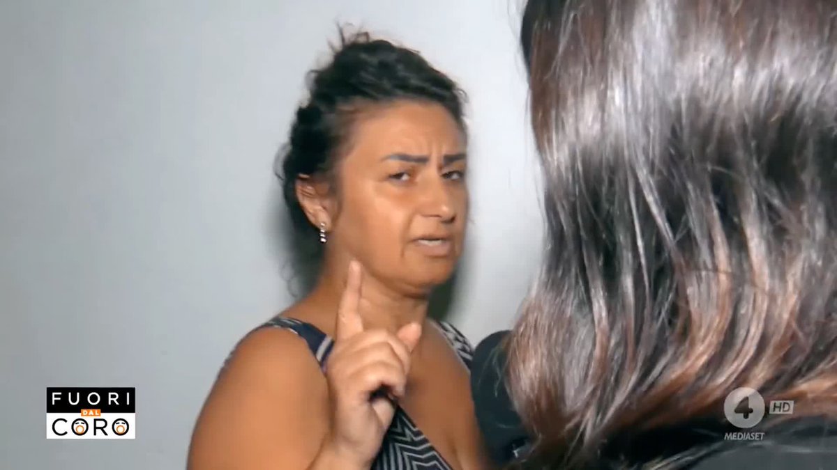 Screenshot from the Italian TV show 'Fuori dal Coro' on Canale 4 showing a woman with dark hair pointing her finger while speaking to another woman with brown hair.