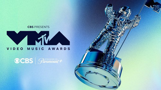The promotional image for the MTV Video Music Awards features the iconic silver astronaut trophy alongside the event's logo, displaying text including "CBS PRESENTS," "VMA VIDEO MUSIC AWARDS," "CBS," and "STREAMING ON Paramount+." The graphic relates to the announcement that the #VMAs ceremony has been delayed, likely tying into news about changes to the awards show's scheduling or broadcast plans.