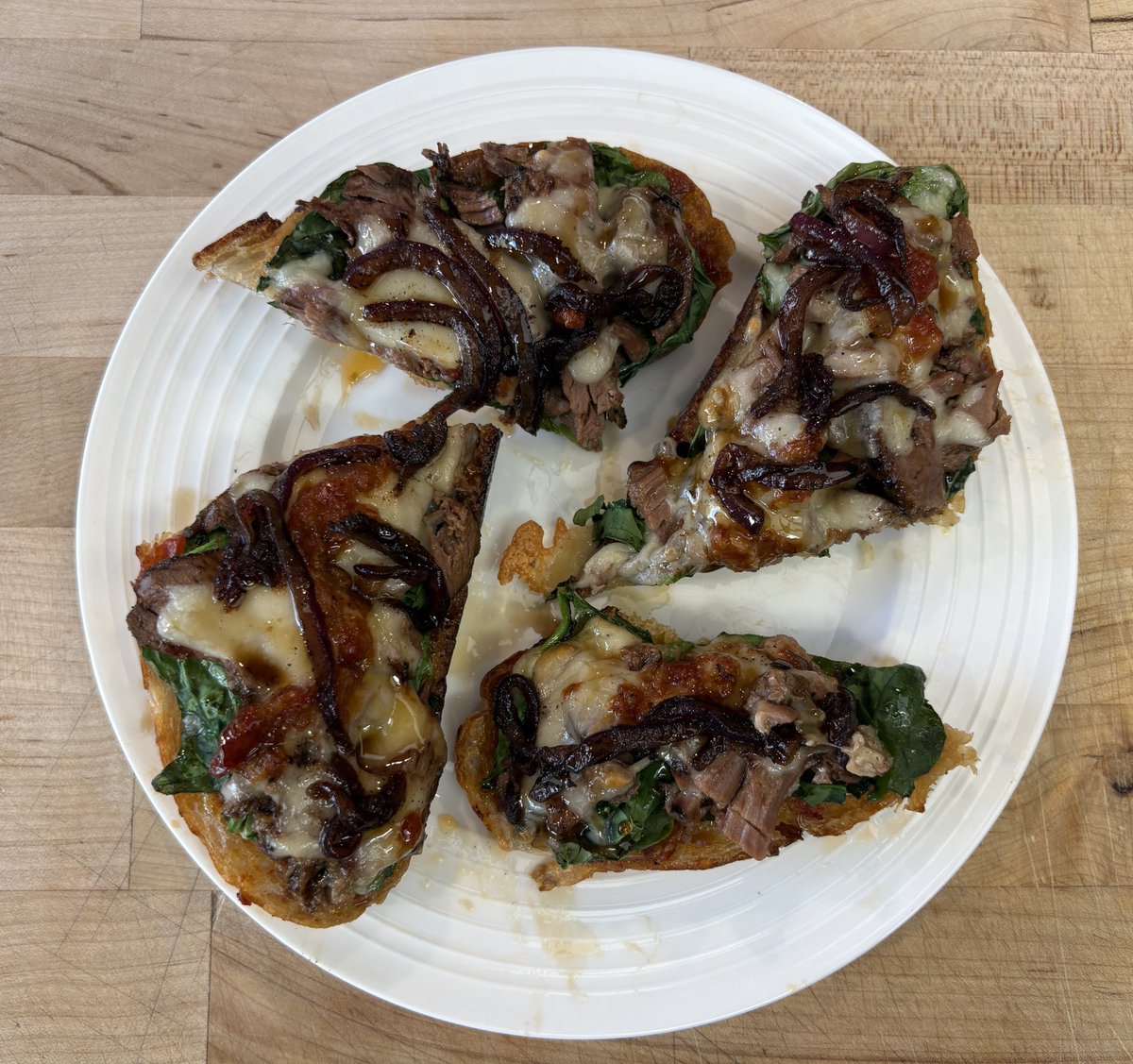 zillaah707's tweet photo. Fridge clean out to fancy toasts. Homemade sourdough, roasted garlic tomatoes I made last weekend, spinach, left over lamb roast, horseradish cheddar, sautéed onions and balsamic drizzle https://t.co/OP3s3FXXIw