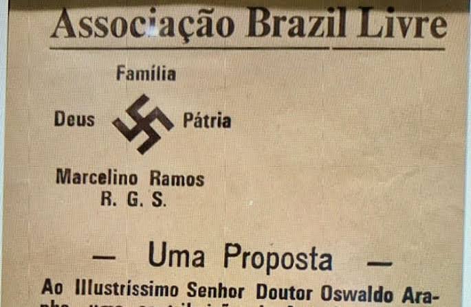 _blasfemme_'s tweet photo. @atenadesgracada Vocês levaram todo esse tempo para perceber?
Já começa com o lema: "Brasil acima de tudo". É igual ao "Deutschland über alles (Alemanha acima de tudo)"
O número 22 sendo "igual" ao Schutzstaffel (SS) nazista. E o famoso "Deus, Pátria e Família" do partido nazista brasileiro. https://t.co/B4qFf2Ivub