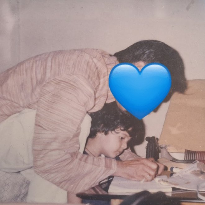 srishtwo's tweet photo. my mother captured this. papa is teaching me how to hold a pencil and write. 
p.s. original photo has my sibling's leg in frame that i cropped out lmao https://t.co/q7hDILiDA0