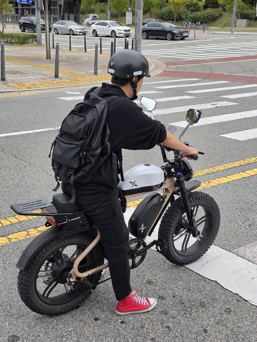 Victorokeke_'s tweet photo. It's a bicycle. an X-Rider electric bike. The white fuel tank is a camouflage https://t.co/HDXd23wwf3