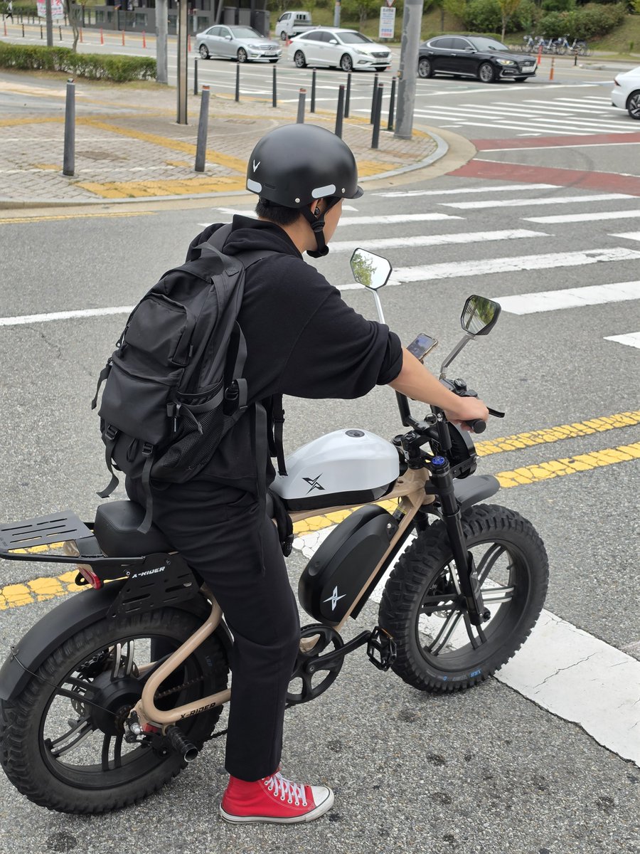Victorokeke_'s tweet photo. It's a bicycle. an X-Rider electric bike. The white fuel tank is a camouflage https://t.co/HDXd23wwf3