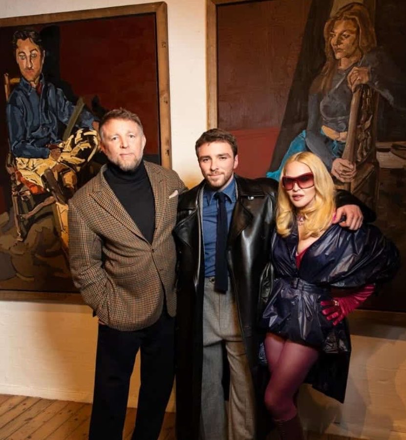 Femzyr0's tweet photo. Madonna's eldest son, Rocco, Reminisced about the role he played in keeping his parents connected as friends after their messy divorce. He shared these thoughts
 during his recent visit to his art collection Gallery.

According to the Report, Rocco recalled how, when his parents split, his mother wanted to take him away from his father which would have cut off his dad's access to him completely. But even as a young kid, he chose to stay with his father. Madonna was furious and stopped talking to him for a while. But she couldn't stay away for long. She started calling to check on him, and sometimes she'd even call his dad just to see how he was doing. 

That's how they kept talking because of him. They even came together in 2025, again because of him. Rocco admitted he doubts things would have turned out the same if he had chosen to live with his mother instead. In the end, he thanked both of his parents for supporting his career and promised to make them proud.