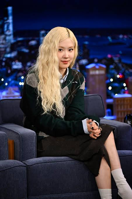 KpopChartWire's tweet photo. rosé carried one guitar from a 700-person audition to blackpink

in 2012, 15-year-old rosé left melbourne for seoul after ranking first among 700 people at yg entertainment’s sydney audition, entering its k-pop trainee system with no promise that she would ever debut.

the strange part is that the audition had not been her plan.

rosé had grown up filling quiet evenings with piano and singing that ran past midnight until her family told her to stop.

her first guitar was a $70 blue model that hurt her fingers so much she cried, so at about 14 she gathered her saved pocket money and bought a taylor gs mini.

when her father saw that yg was holding a rare australian audition, he told the girl who sang every night to try.

rosé thought he was joking and doubted she could sing properly, but he argued that one failed attempt would hurt less than wondering about it years later.

she flew to sydney with that guitar and played jason mraz’s “i won’t give up” for the judges.

surrounded by strong singers, she assumed her small adventure was already over.

instead, yg called her back, told her she had placed first and asked her to move to south korea within two months.

her mother had opposed the risk because nothing was guaranteed, while rosé was young enough to imagine the dorm as the exciting bit rather than a separation.

that changed in seoul when her parents said goodbye and explained that they had to fly home.

rosé suddenly understood that they were leaving her there, and she cried alone in the dorm.

then the guitar gave the night a different ending.

jennie asked chaeyoung, rosé’s korean name, to play something, so rosé sat around the kitchen table with jennie, jisoo and lisa in their pyjamas.

jisoo found the harmonies, the chairs eventually gave way to the tabletop, and the four teenagers kept singing until sunrise (somehow, the neighbours let them).

none of them knew that this exact dorm lineup would survive the years of monthly tests and become blackpink.

the days ahead were harder than that first jam suggested.

rosé had never danced before training, so jennie showed her the basics, while watching lisa made her want to improve.

practice could run for more than 12 hours, friends were sent home, and rosé said she sometimes cried in the bathroom before moving straight to the next task.

she stayed late for an empty practice room because flying back to australia and explaining that she had failed felt unbearable.

blackpink finally debuted in 2016, four years after one guitar turned rosé’s loneliest arrival into their first night together.

a decade after the audition, rosé said she still played that guitar, now older than her dog hank.

before blackpink had a name or a song, its final four had already found one another around rosé’s strings as the sun came up.