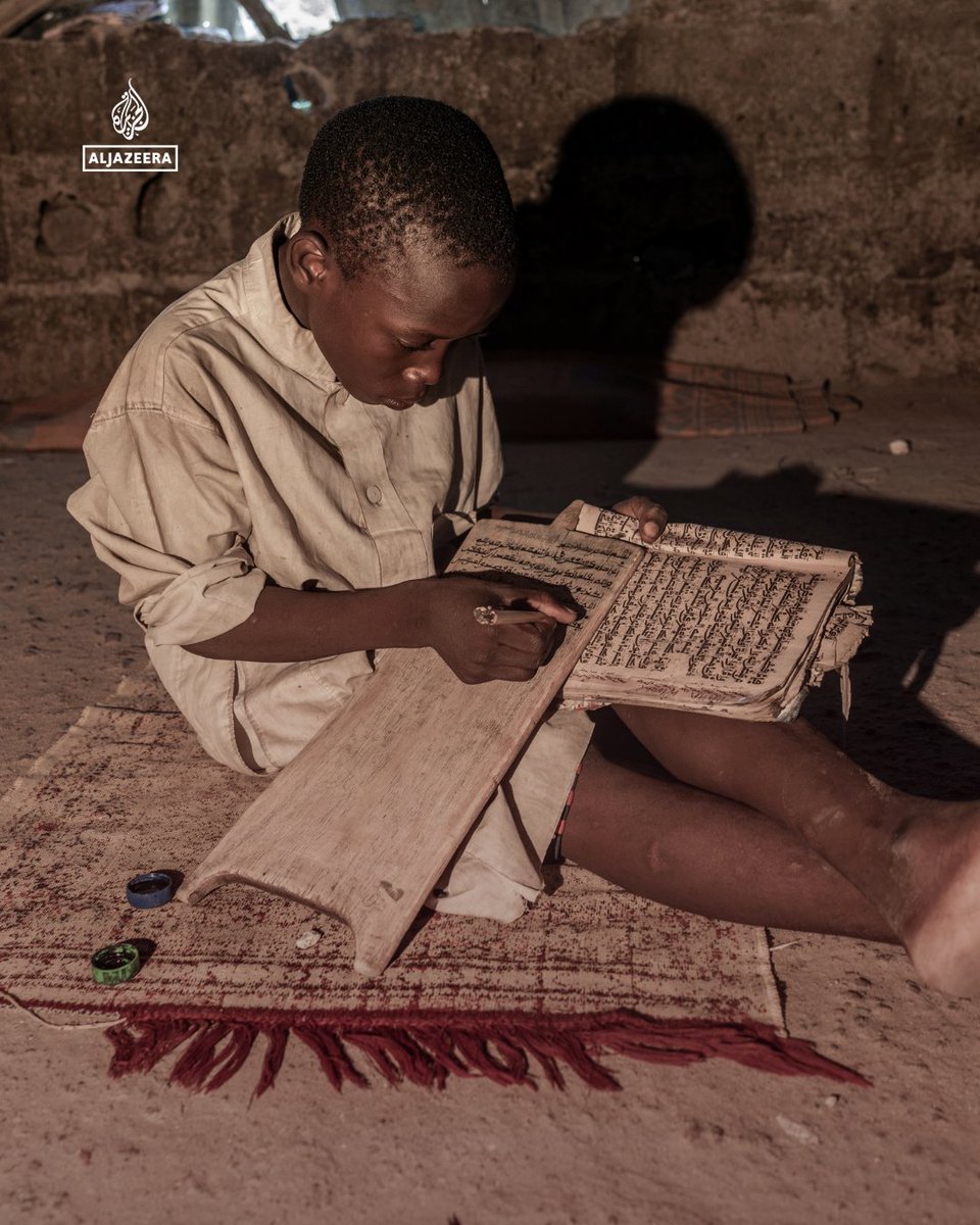 AJEnglish's tweet photo. Students gather in modest learning spaces to write and recite Quranic verses and surahs on the tablets, preserving a centuries-old method passed down through generations. https://t.co/CBzLpDjZe1