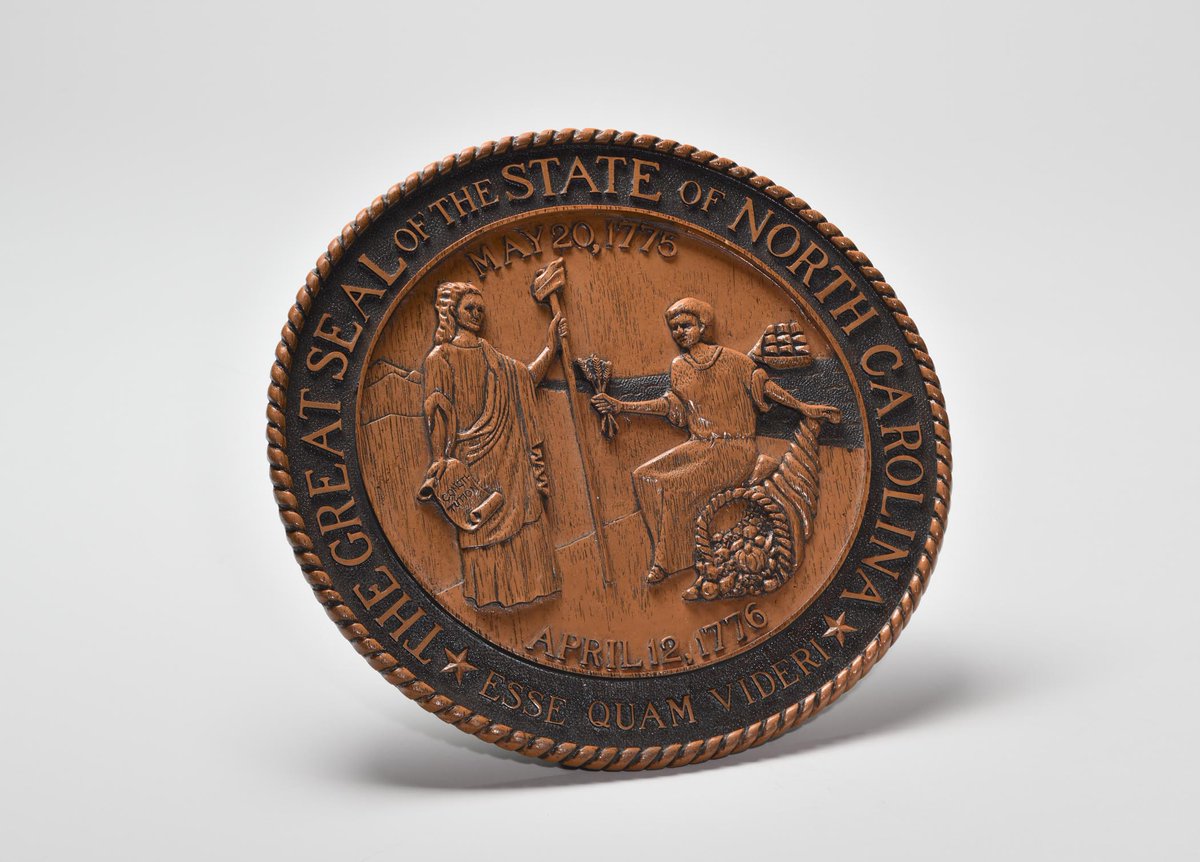 NCmuseumhistory's tweet photo. Happy #NationalNorthCarolinaDay! Check out a few artifacts celebrating our great state. Here's to the land of the long leaf pine! 
1: A wooden carving of the state seal
2: North Carolina postcard
3: North Carolina commemorative plate
4: The North Carolina state toast https://t.co/lLgSCI16u0