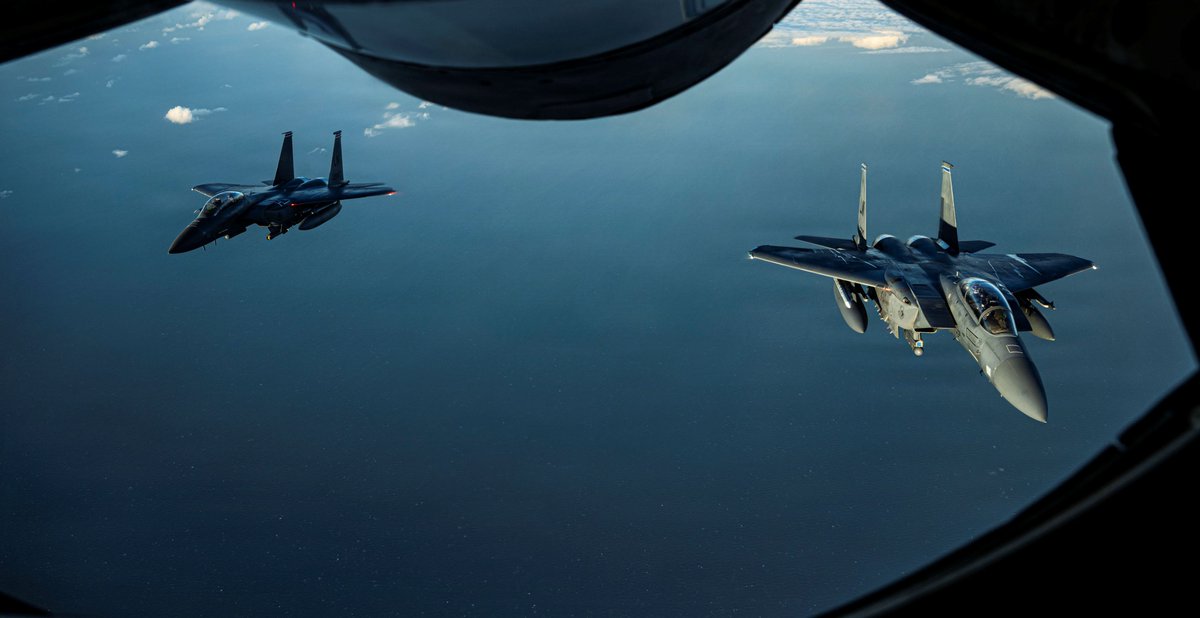 DeptofWar's tweet photo. A @usairforce F-15E Strike Eagle fighter jet deploys flares over the North Sea, extending the reach of combat airpower. https://t.co/kzGoe129qU